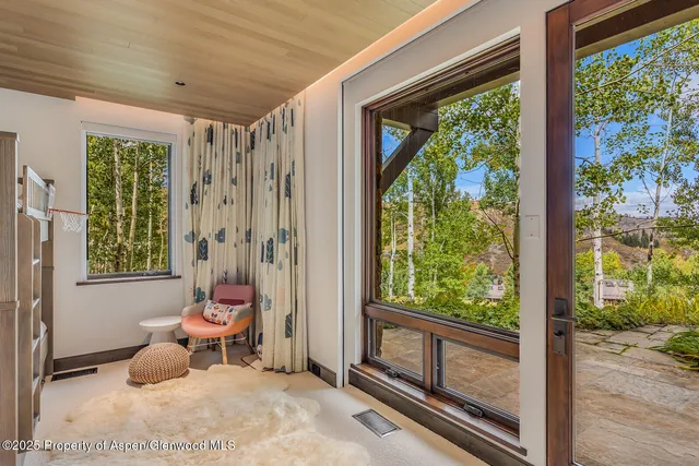 a bathroom with a granite countertop sink mirror and a toilet