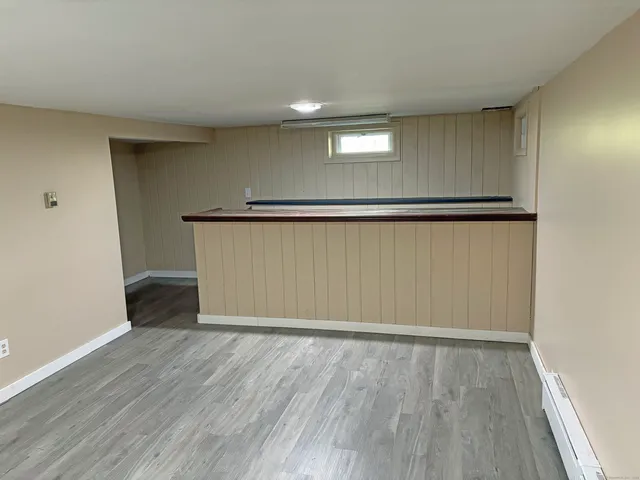 an empty room with wooden floor