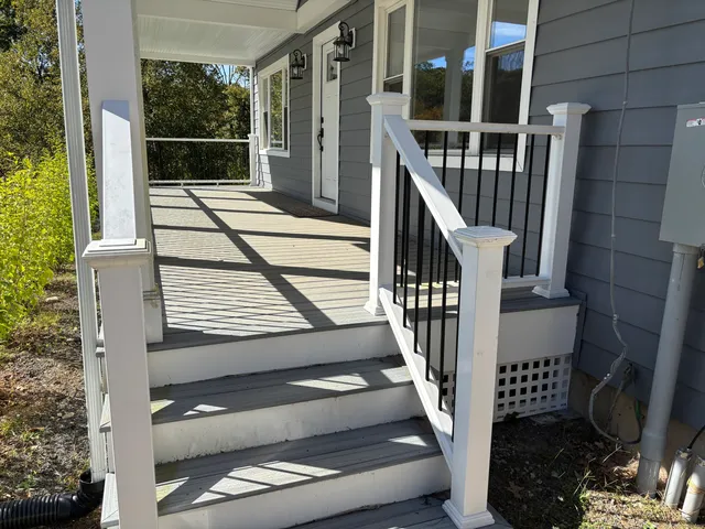 a view of balcony with wooden floor