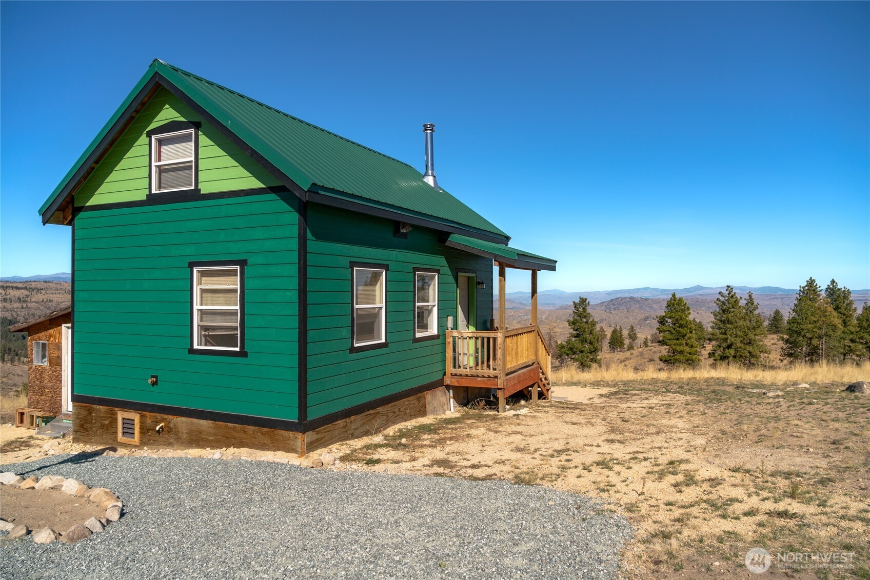 454 Harmony Heights Road Brewster, WA 98812 - Photo 2 of 24 a front view of a house with a yard