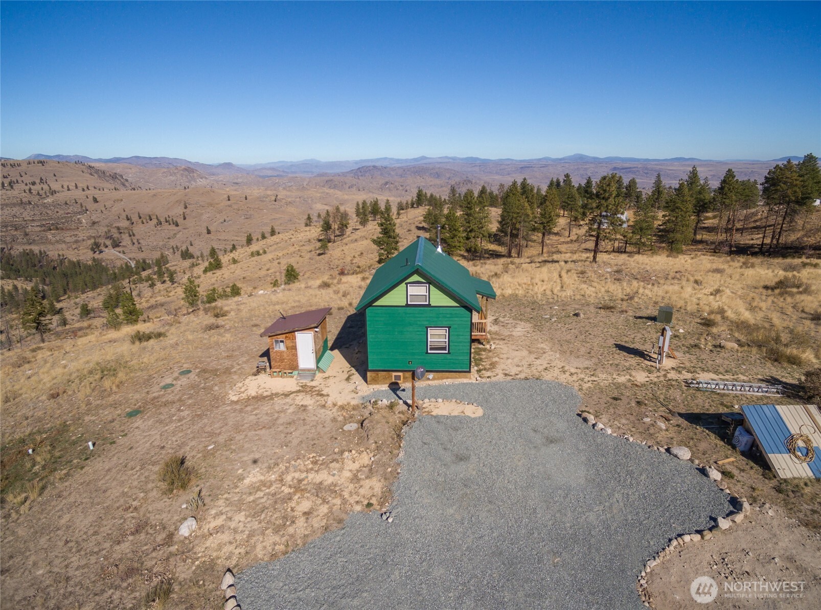 454 Harmony Heights Road Brewster, WA 98812 - Photo 24 of 24 a view of a dry yard with wooden fence