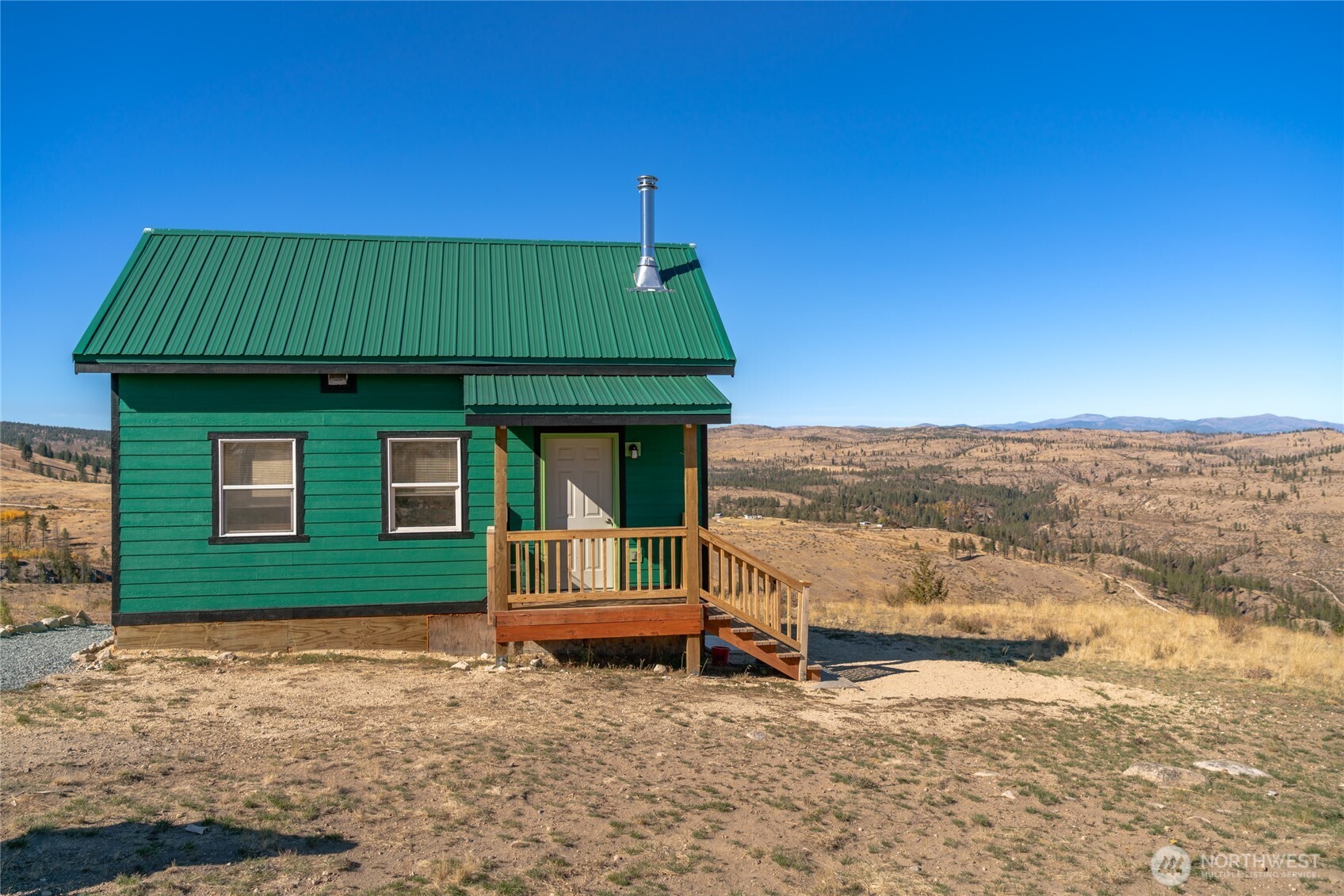 454 Harmony Heights Road Brewster, WA 98812 - Photo 3 of 24 a view of a house with a yard