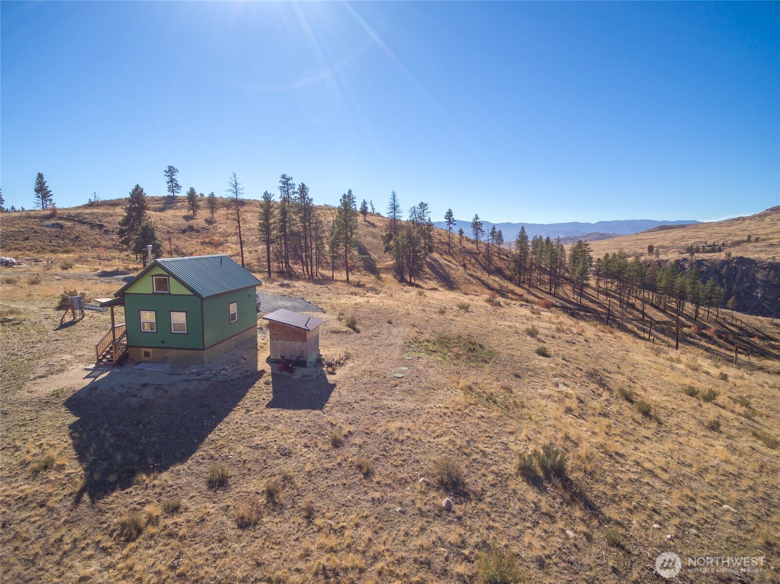 454 Harmony Heights Road Brewster, WA 98812 - Photo 7 of 24 a view of a houses with a yard