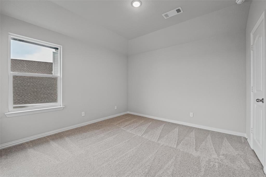 1205 Colca Drive Springtown, TX 76082 - Photo 29 of 37 Wall-to-wall carpeting, recessed lighting, and a single window with white trim