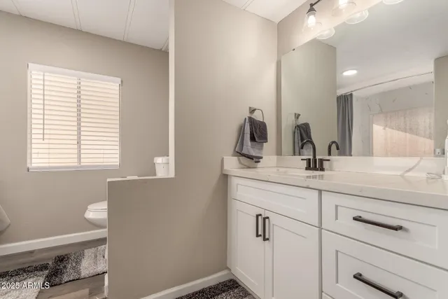 a bathroom with a sink and a window