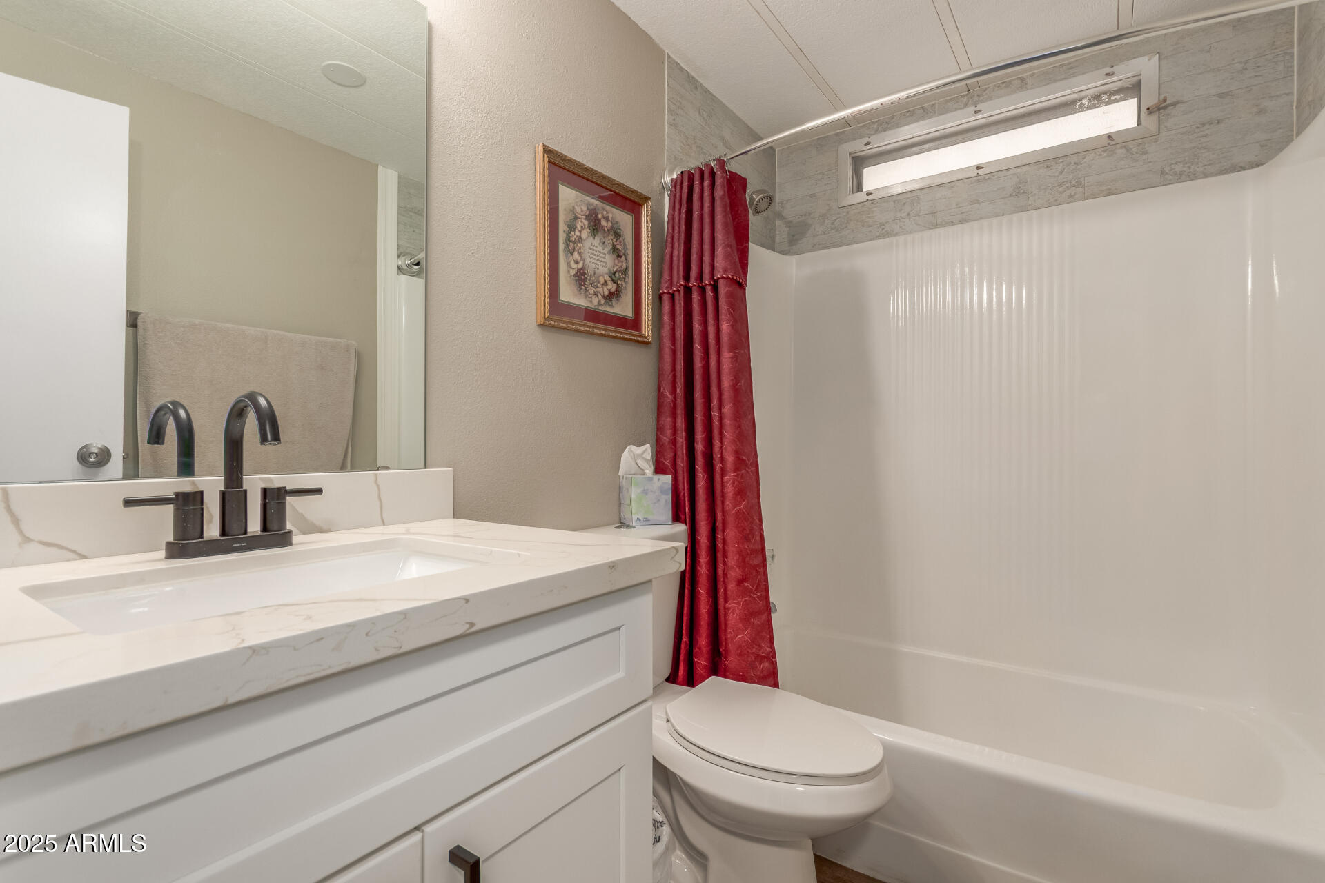 5263 East McDowell Road Mesa, AZ 85215 - Photo 17 of 40 a bathroom with a sink a toilet and a bathtub