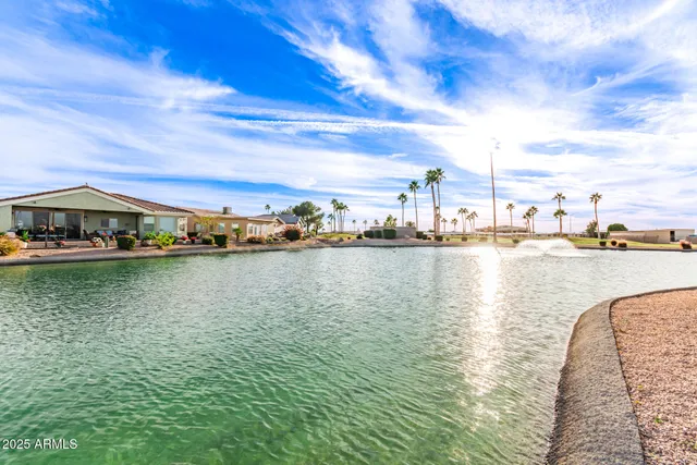 a view of swimming pool with outdoor seating and yard