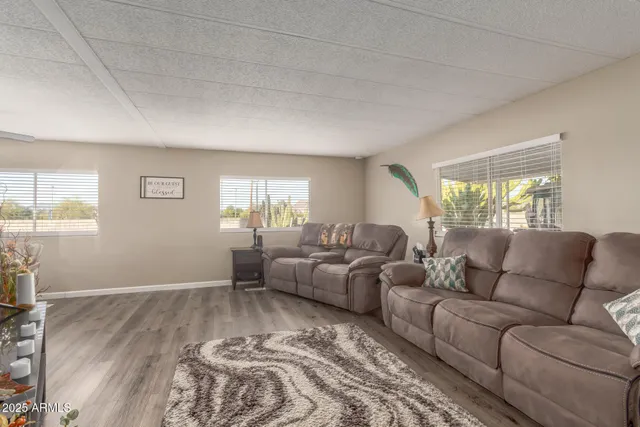 a living room with furniture and a window