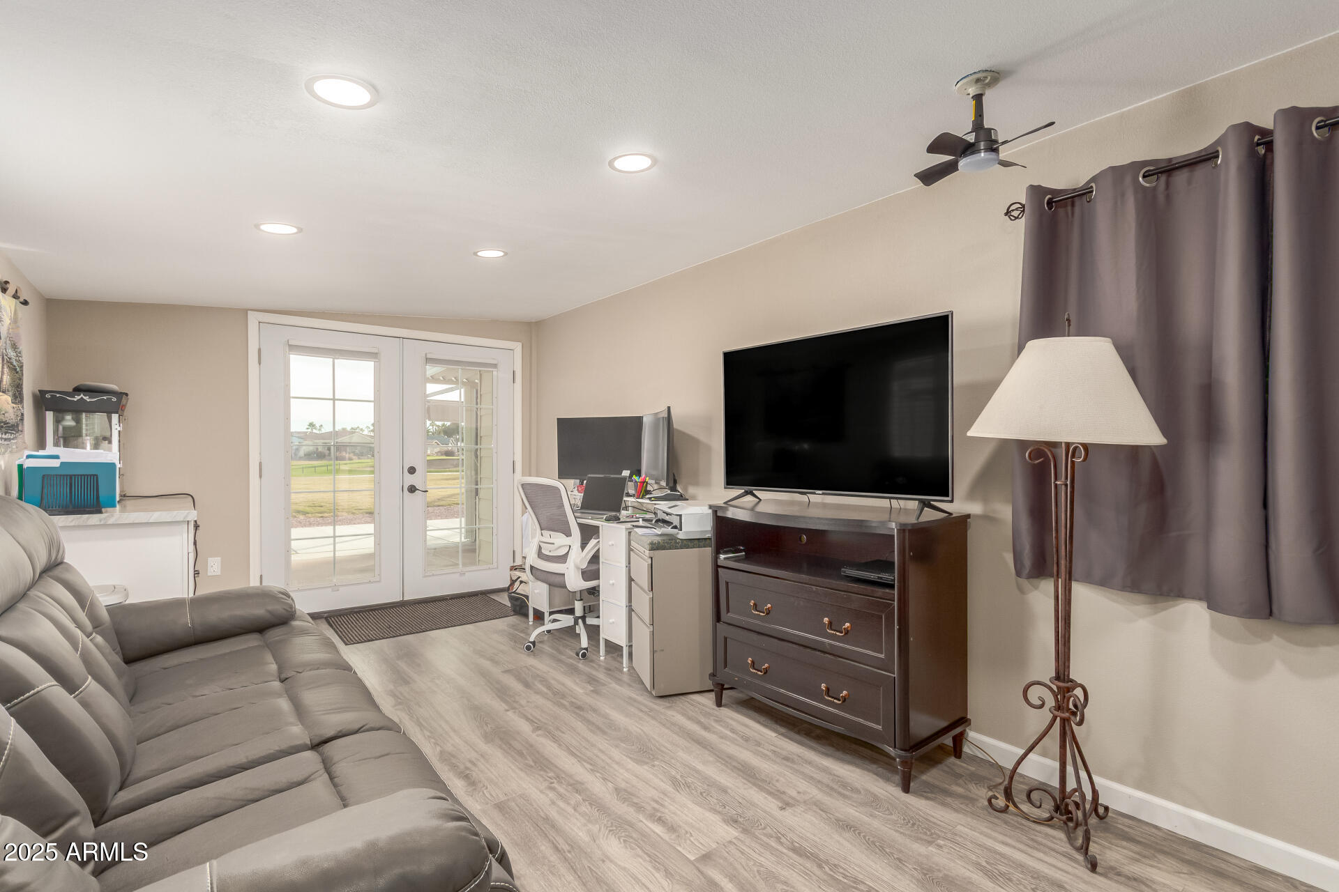 5263 East McDowell Road Mesa, AZ 85215 - Photo 5 of 40 a living room with furniture and a flat screen tv
