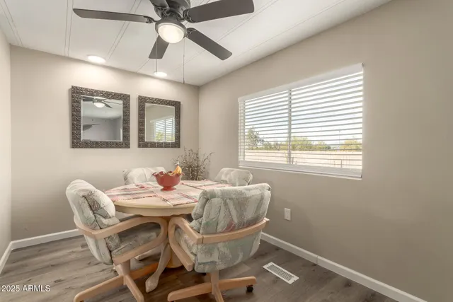 a dining room with furniture and window