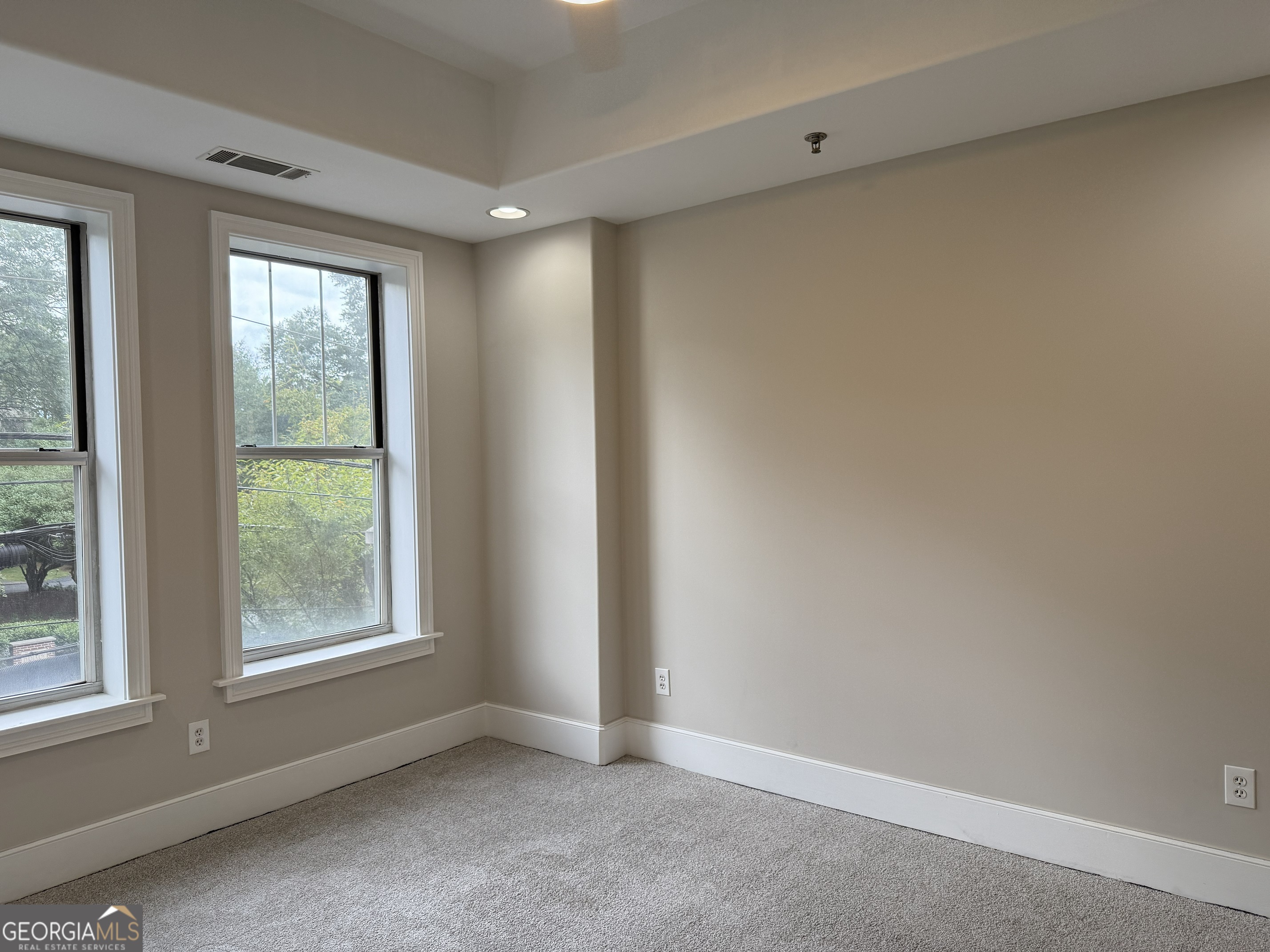 2255 Peachtree Road Northeast, Unit 322 Atlanta, GA 30305 - Photo 14 of 31 a view of an empty room with a window
