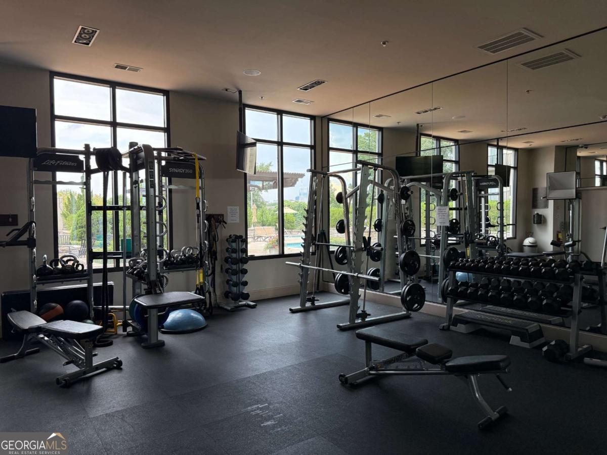 2255 Peachtree Road Northeast, Unit 322 Atlanta, GA 30305 - Photo 21 of 31 a view of a room with gym equipment