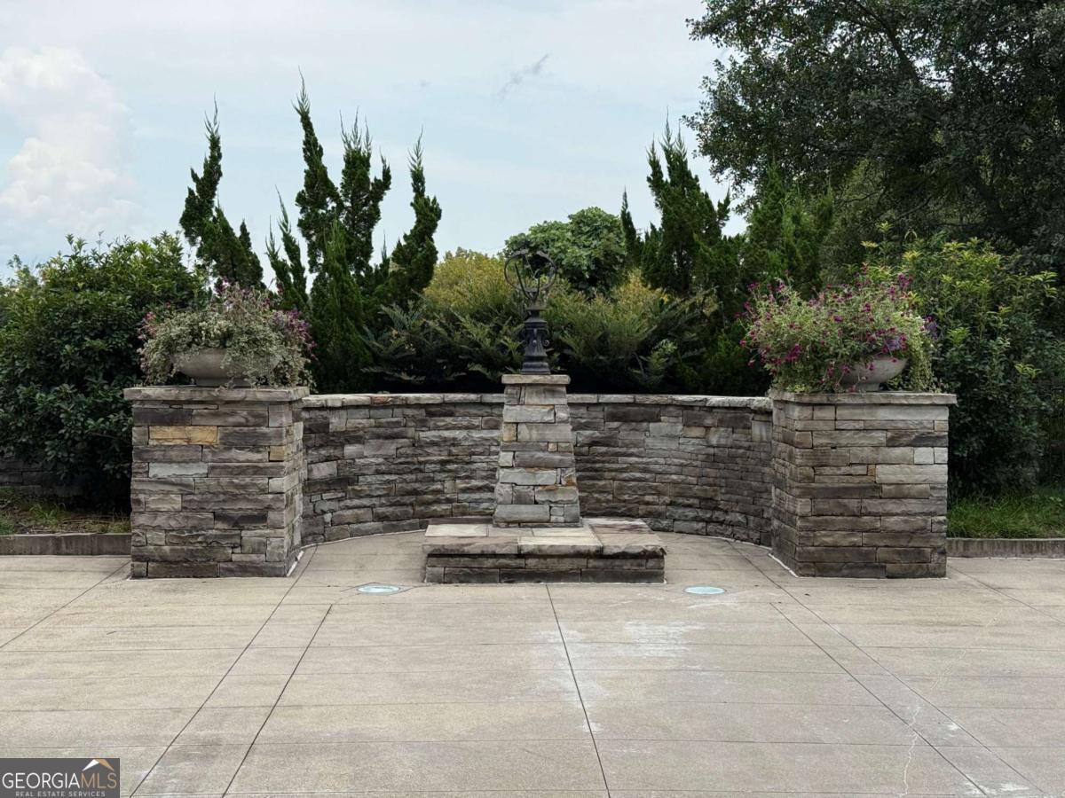 2255 Peachtree Road Northeast, Unit 322 Atlanta, GA 30305 - Photo 25 of 31 a backyard of a house with outdoor seating