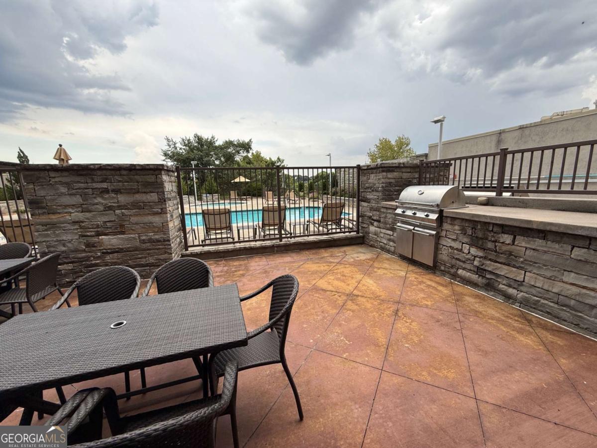 2255 Peachtree Road Northeast, Unit 322 Atlanta, GA 30305 - Photo 26 of 31 a terrace of a house with outdoor seating