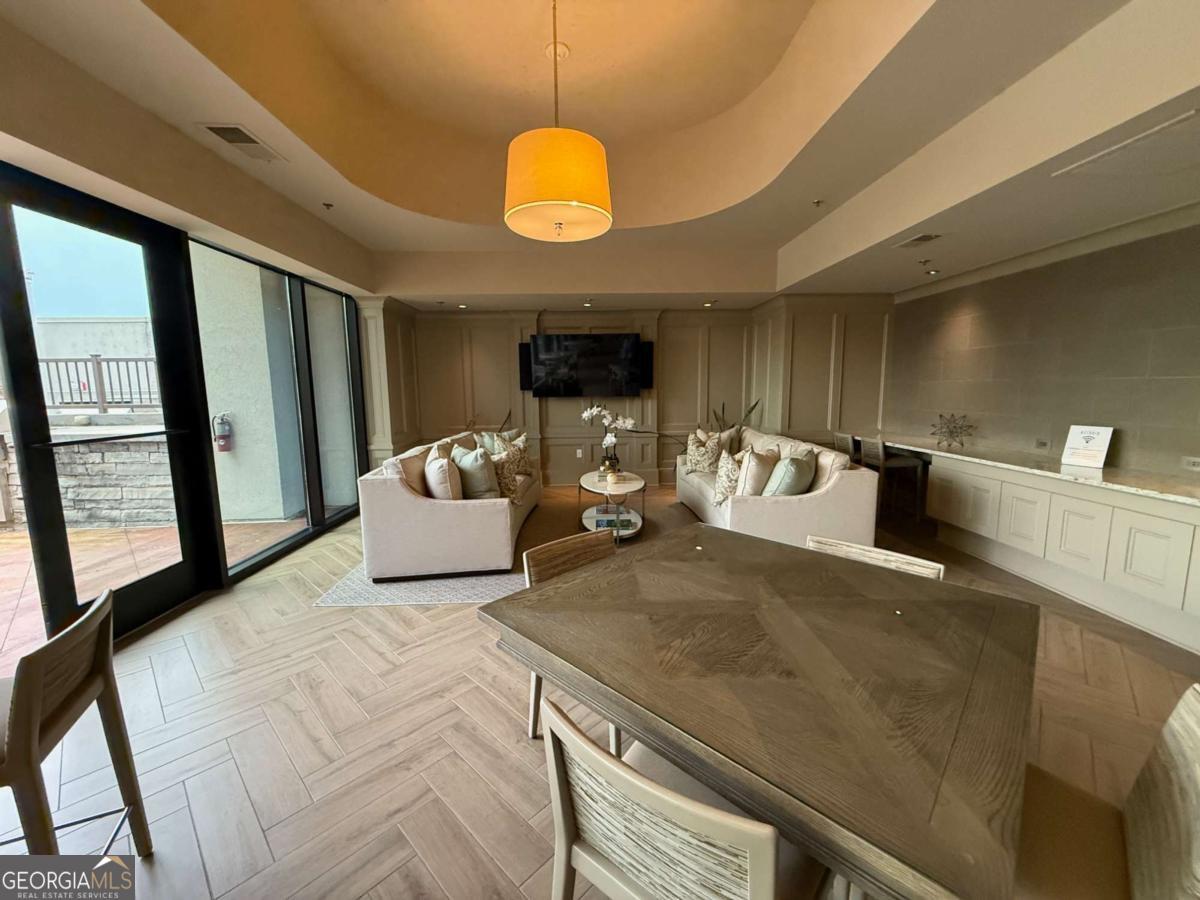 2255 Peachtree Road Northeast, Unit 322 Atlanta, GA 30305 - Photo 29 of 31 a bedroom with a bed and window