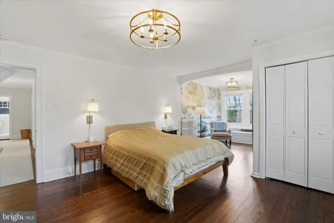 a bedroom with a bed and a table in it
