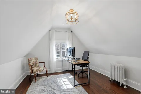 a workspace with furniture and a window