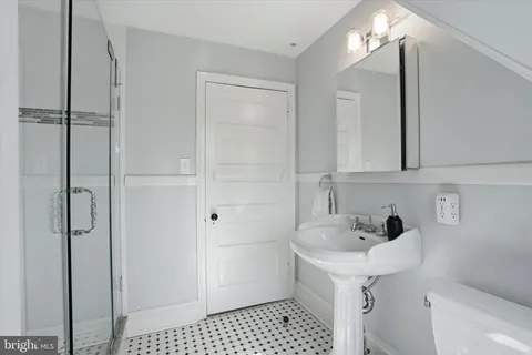 a bathroom with a sink and a shower