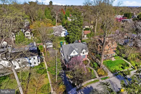 an aerial view of a house with a garden