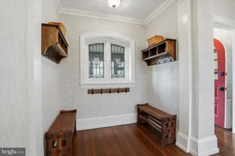a view of an entryway with wooden floor