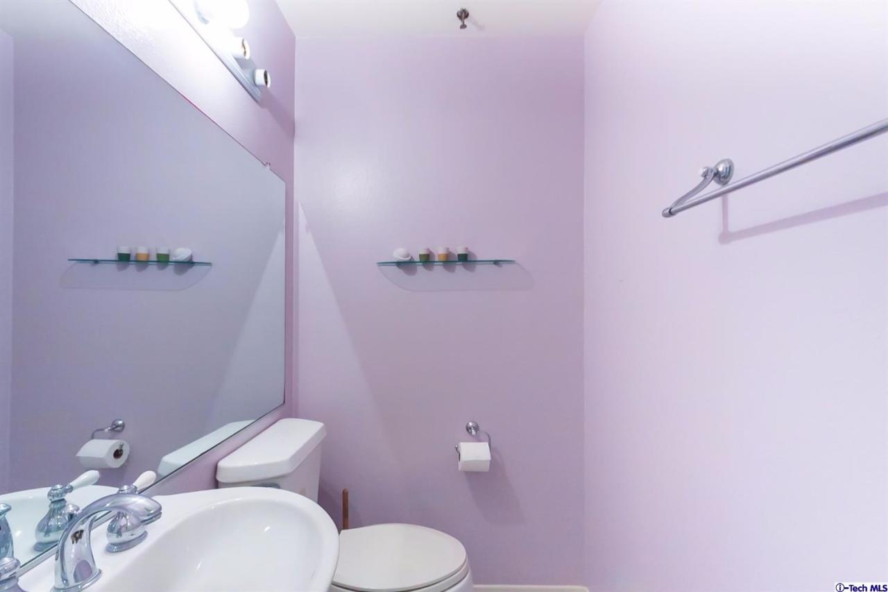 6255 Honolulu Avenue, Unit 5 Tujunga, CA 91042 - Photo 5 of 10 a bathroom with a sink a toilet and a mirror