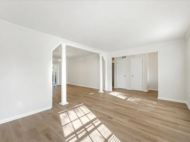 a view of an empty room and window