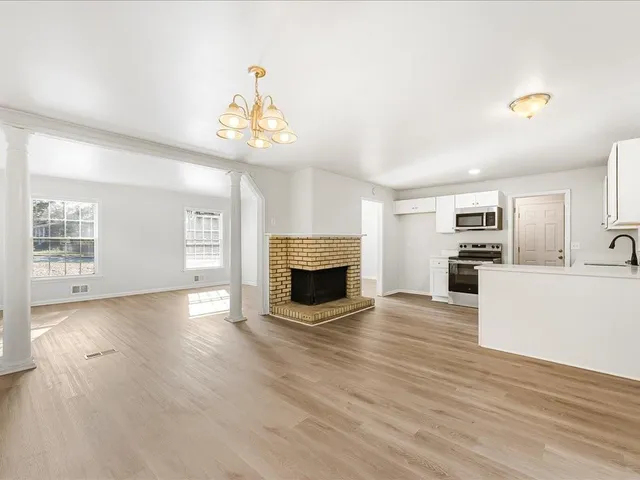 a view of a kitchen with furniture and a fireplace