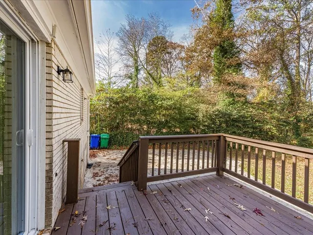 a view of deck with wooden floor and fence