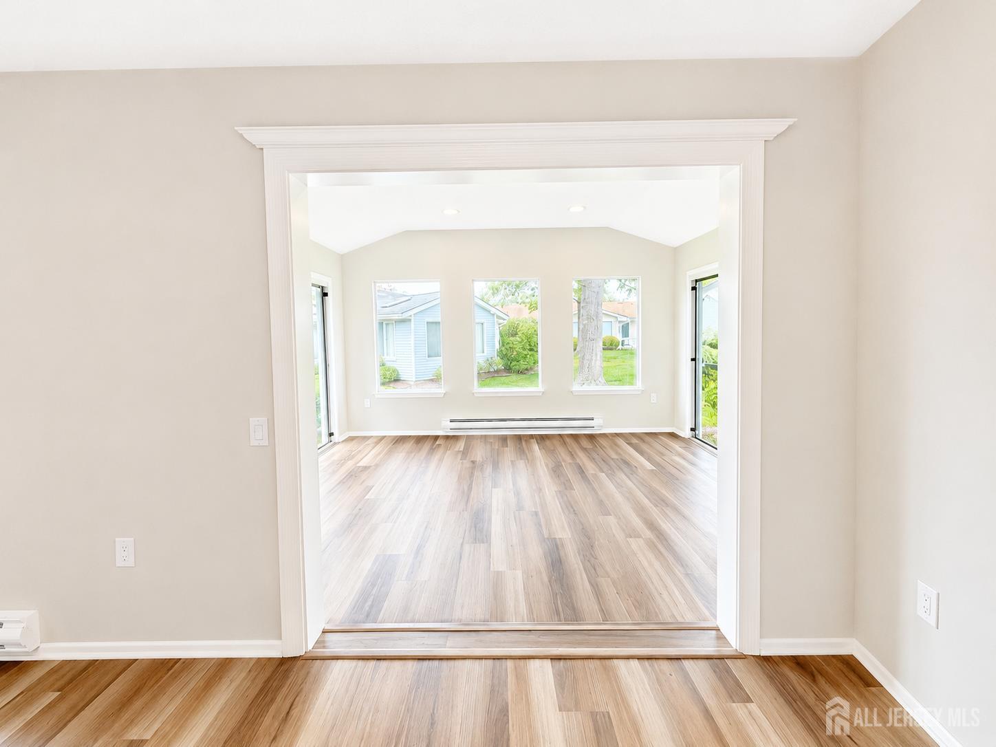 621 A Deal Road Monroe Township, NJ 08831 - Photo 27 of 27 a view of an empty room with wooden floor and a window