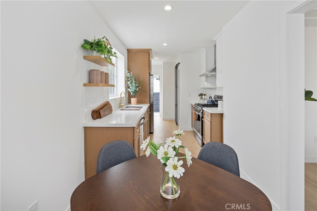 4254 West 58th Place Los Angeles, CA 90043 - Photo 11 of 53 a living room with furniture flowerpot and a fireplace