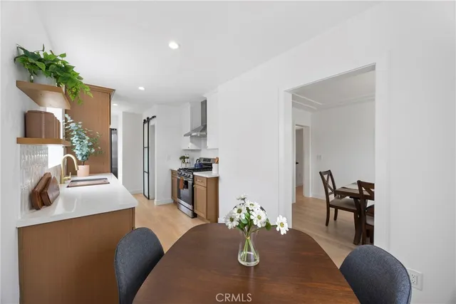 a kitchen with a stove and a refrigerator