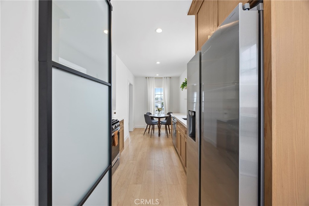 4254 West 58th Place Los Angeles, CA 90043 - Photo 16 of 53 a view of a hallway with dining area