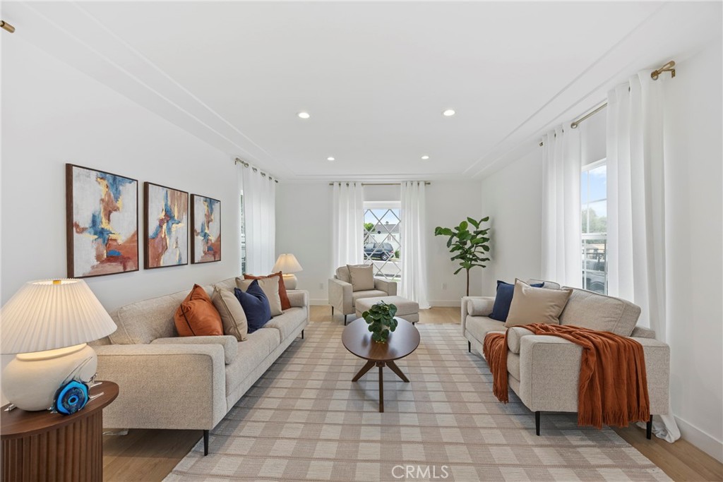 4254 West 58th Place Los Angeles, CA 90043 - Photo 18 of 53 a living room with furniture and a potted plant