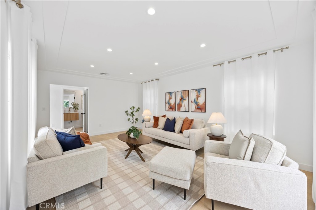 4254 West 58th Place Los Angeles, CA 90043 - Photo 20 of 53 a living room with furniture and a wooden floor