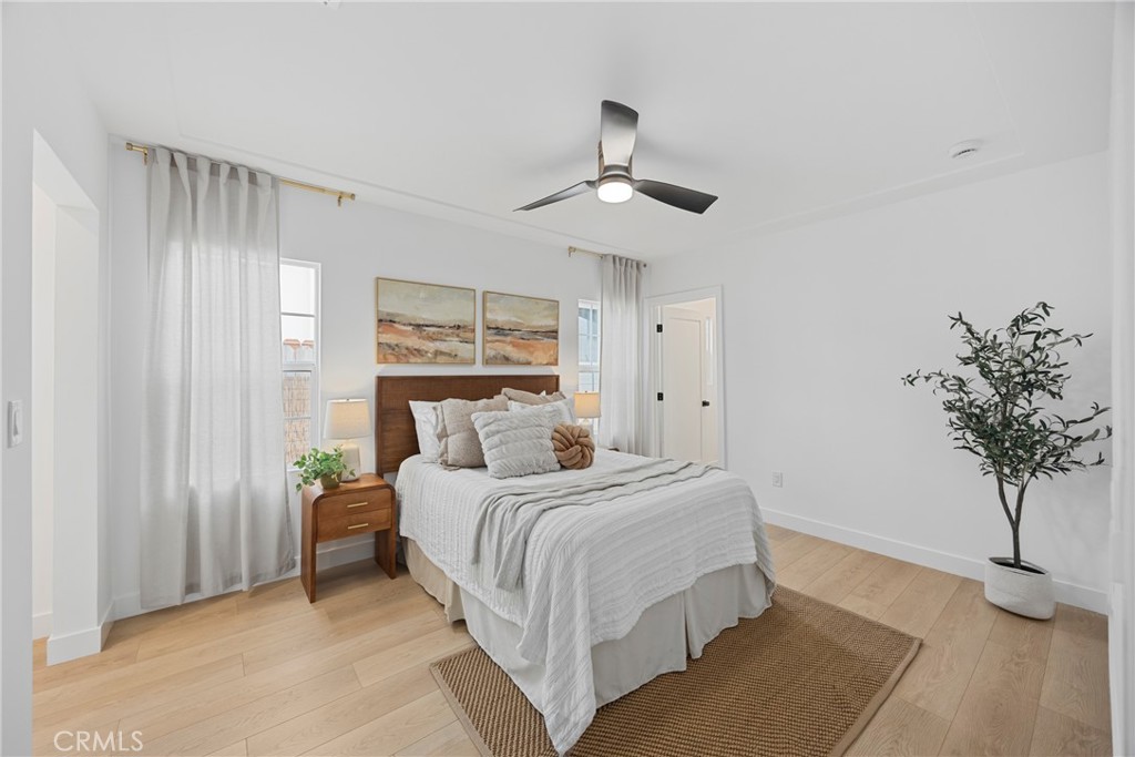 4254 West 58th Place Los Angeles, CA 90043 - Photo 26 of 53 a bedroom with a bed and a potted plant