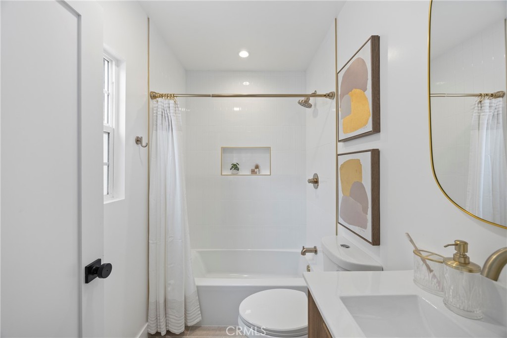 4254 West 58th Place Los Angeles, CA 90043 - Photo 29 of 53 a bathroom with a toilet sink and shower