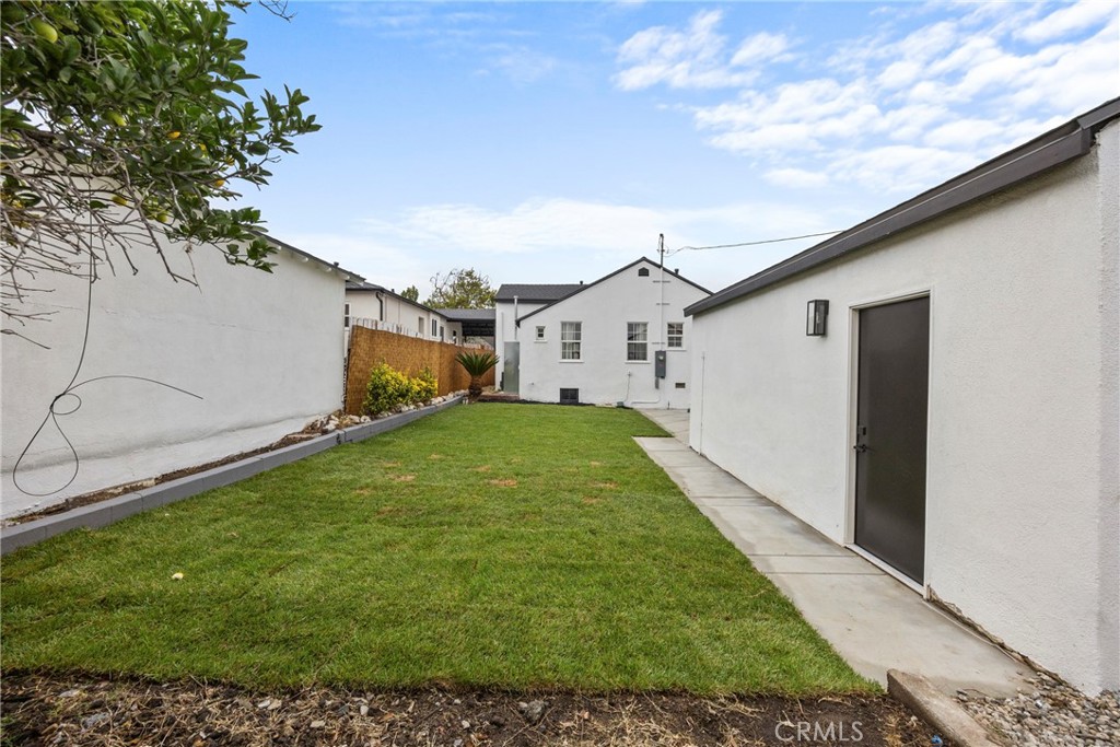 4254 West 58th Place Los Angeles, CA 90043 - Photo 35 of 53 a house view with a backyard space