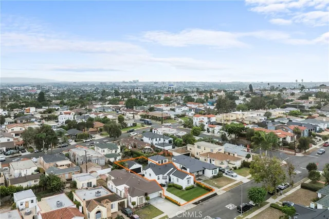 a aerial view of a house with a yard