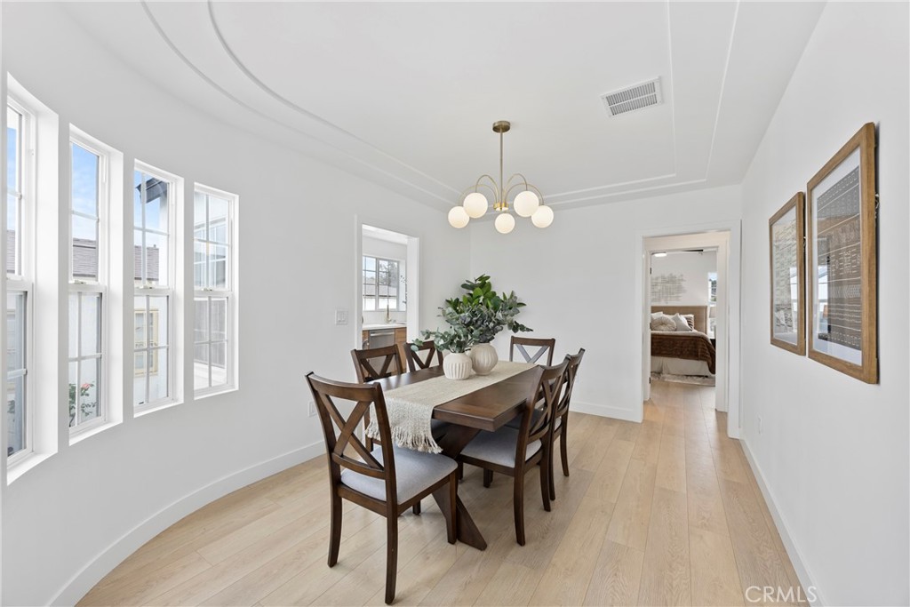 4254 West 58th Place Los Angeles, CA 90043 - Photo 5 of 53 a view of a dining room with furniture window and wooden floor