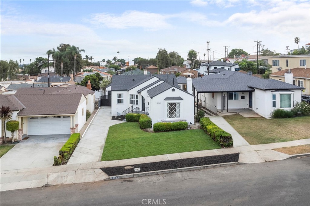 4254 West 58th Place Los Angeles, CA 90043 - Photo 52 of 53 a aerial view of a house with a yard