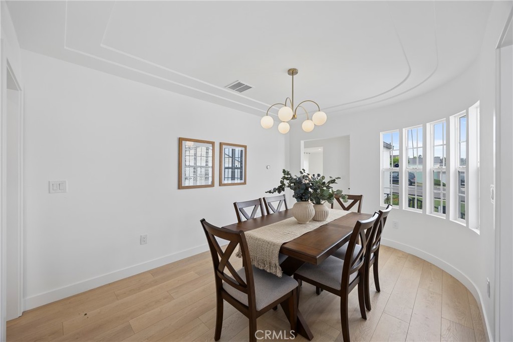 4254 West 58th Place Los Angeles, CA 90043 - Photo 6 of 53 a view of a dining room with furniture and chandelier