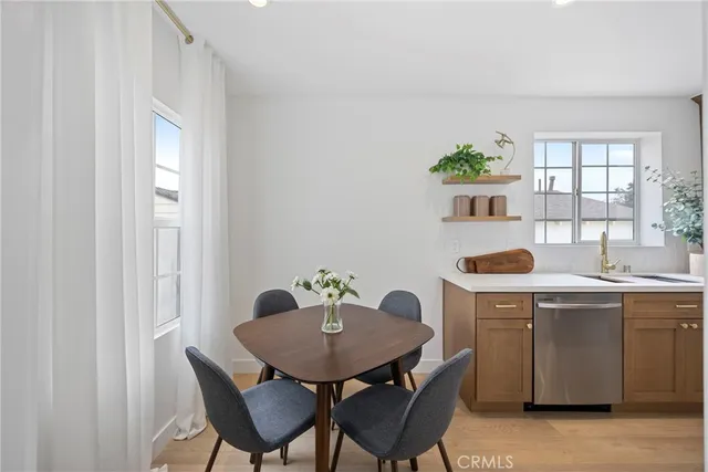 a dining room with furniture and wooden floor
