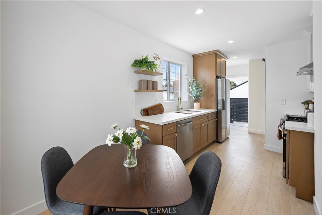 4254 West 58th Place Los Angeles, CA 90043 - Photo 9 of 53 a dining room with furniture and wooden floor