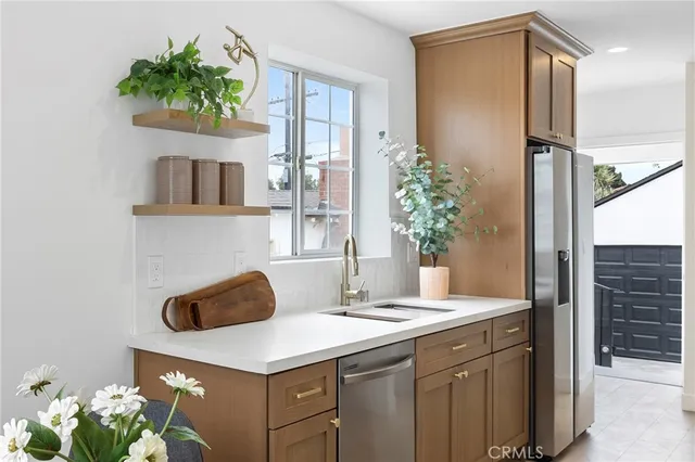 a living room with furniture flowerpot and a fireplace