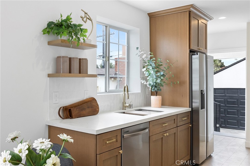 4254 West 58th Place Los Angeles, CA 90043 - Photo 10 of 53 a bathroom with a sink a vanity and a mirror