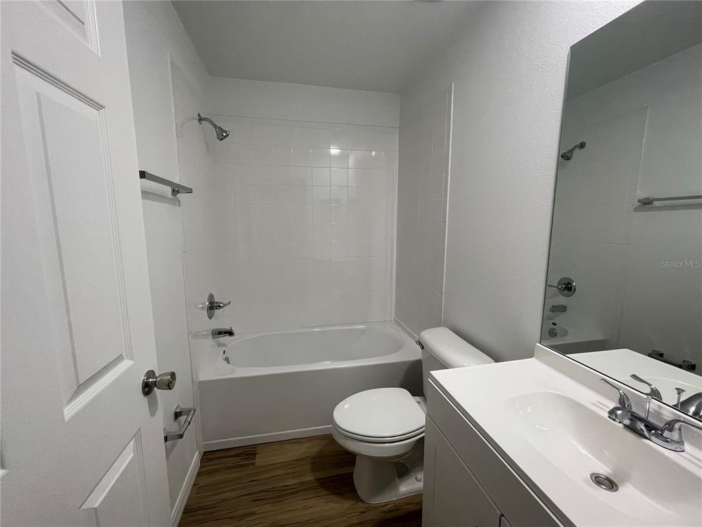 8829 East Marvin Street Floral City, FL 34436 - Photo 6 of 12 a bathroom with a sink toilet and shower