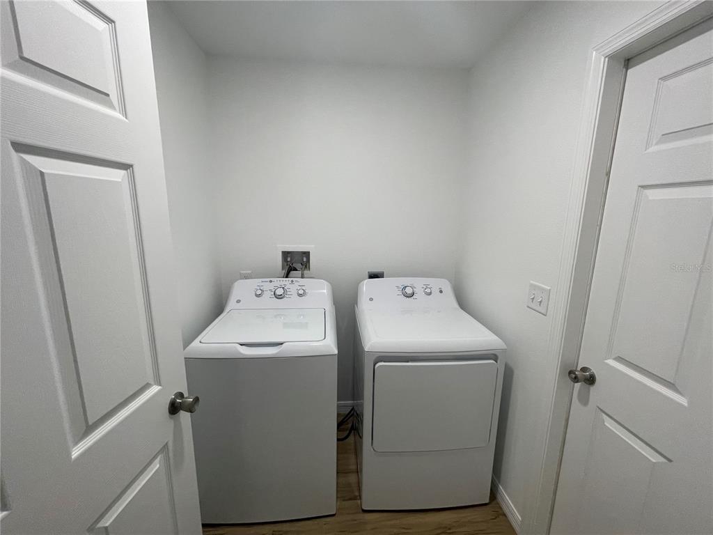 8829 East Marvin Street Floral City, FL 34436 - Photo 10 of 12 a utility room with dryer and washer