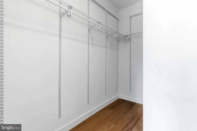 a view of room with staircase and white walls