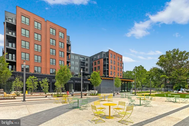 a view of a swimming pool with a lawn chairs