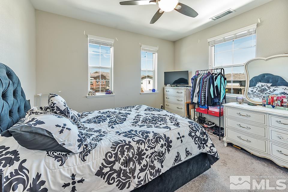 1920 Dark Horse Road, Unit A103 Reno, NV 89521 - Photo 14 of 15 a bedroom with bed and window